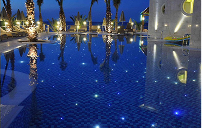 Starlit pool floor with blue mosaic tiles
