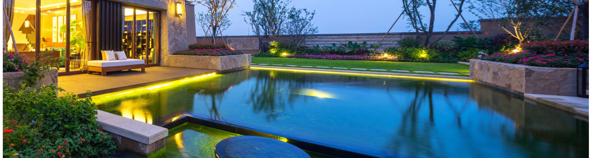 Captivating fiber optic strip lighting under pool coping for a radiant ambiance