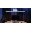 LightEFX Shift desk light set to 3000K warm white color temperature over a workstation