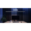 LightEFX Shift desk light set to 4000K neutral white color temperature over a workstation