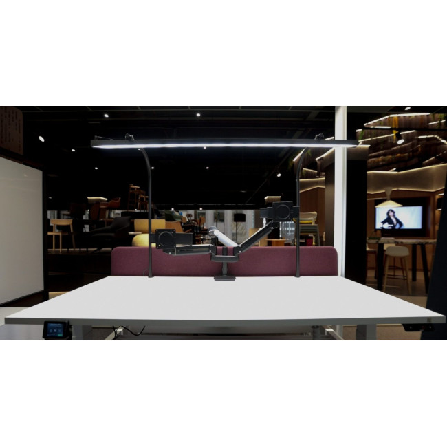 LightEFX Shift desk light showroom display spanning a white desk with monitor arm setup